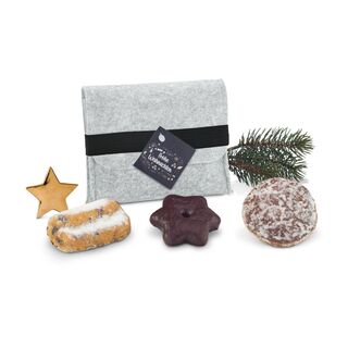 Die ROMINOX® Filztasche mit Gummiband ist gefüllt mit einem Oblaten-Lebkuchen, einem Lebkuchen-Stern und einem Mini-Stollen.